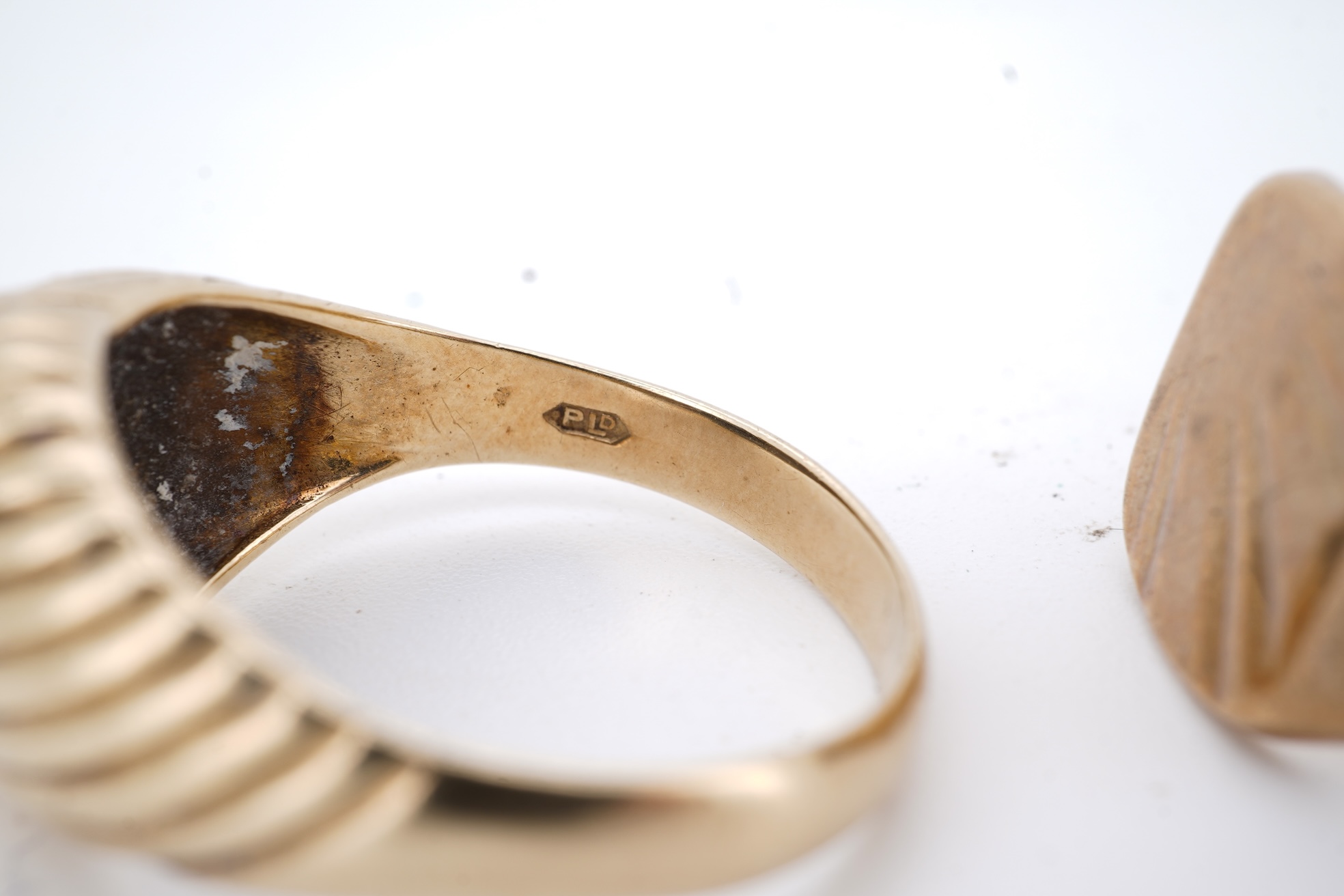 A 1960's 9ct gold and black onyx set signet ring, size X, one other 9ct gold signet ring, a 9ct gold dress stud, a 9ct gold pendant mount and two damaged 9k necklaces, gross weight 21 grams.